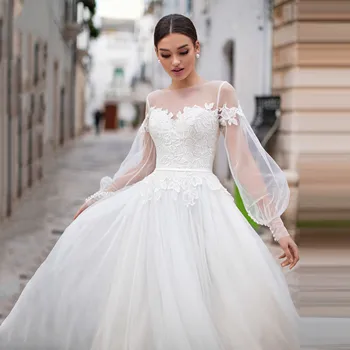 2021 Элегантные свадебные платья Длинные пышные рукава Прозрачные платья невесты с круглым вырезом Кружевные аппликации на пуговицах Vestidos de novia